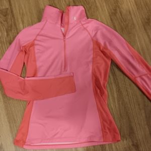Women's Under Armour long sleeved zip up active wear top.